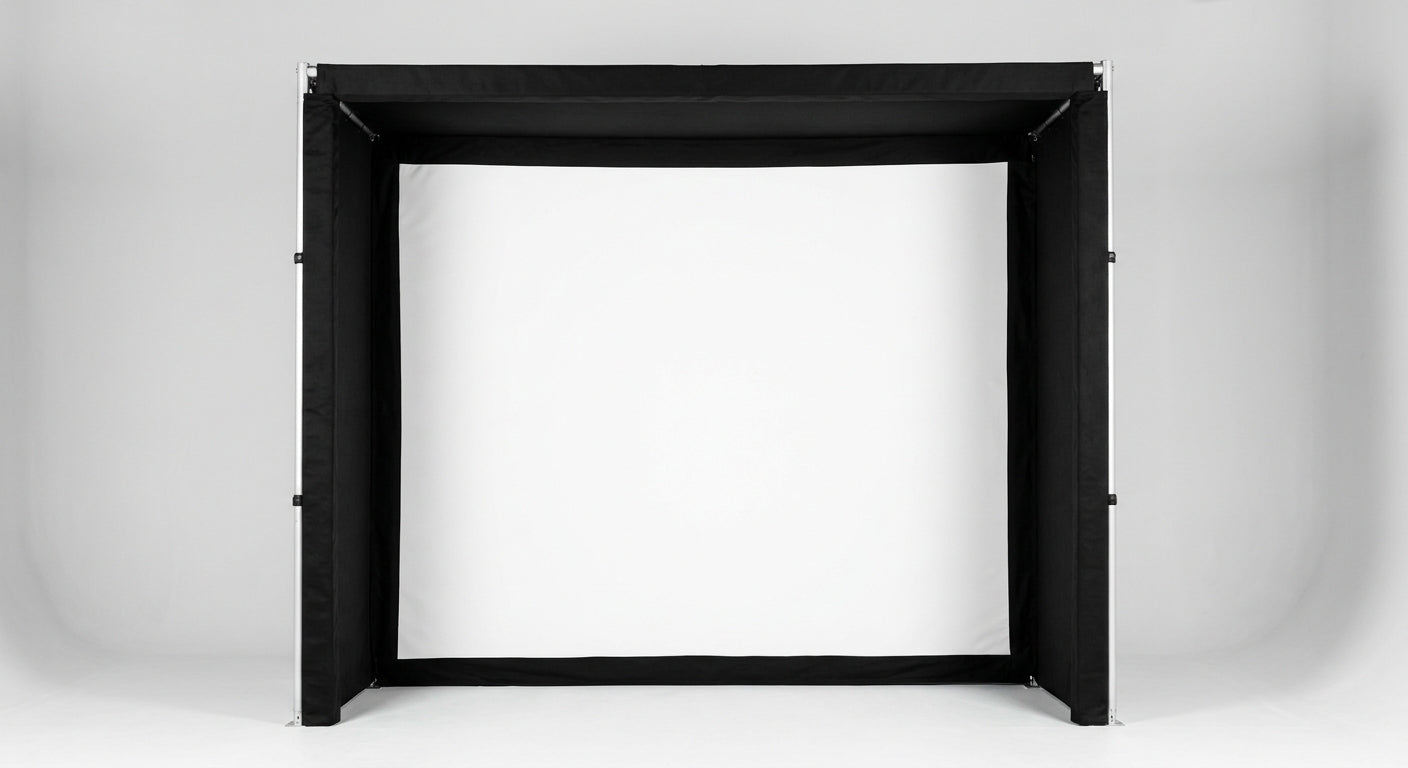 The premium SIG10 indoor golf simulator enclosure featuring a bright white impact screen and heavy-duty black padded borders.