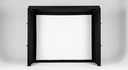 The premium SIG10 indoor golf simulator enclosure featuring a bright white impact screen and heavy-duty black padded borders.